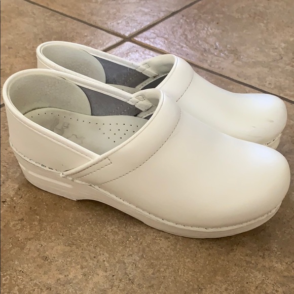 white leather clogs
